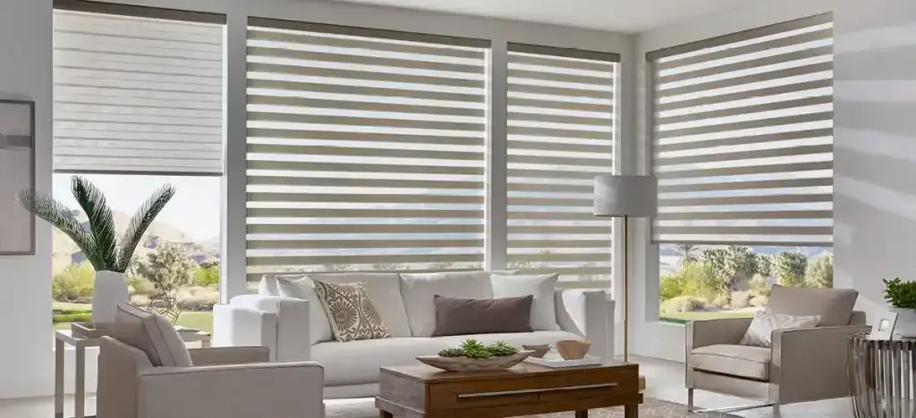 Living room with white sofa, chairs, and window shades