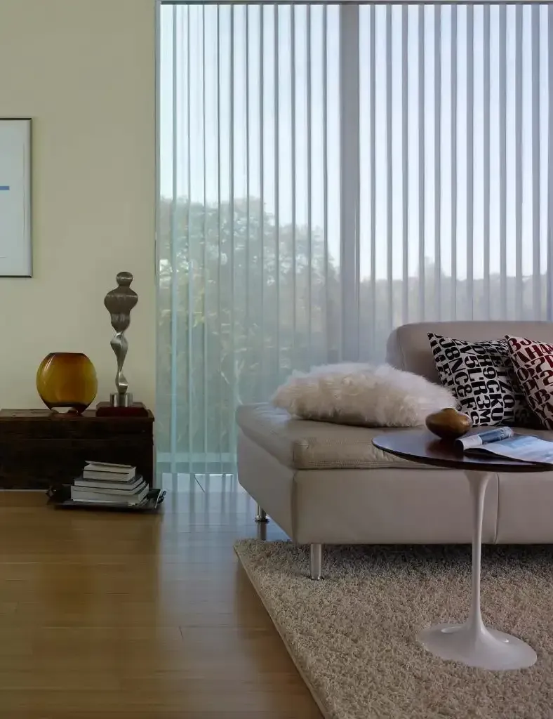 Living room with vertical blinds and a light interior