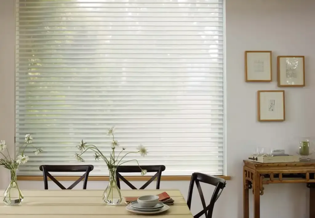 Dining room with a table set and window shades