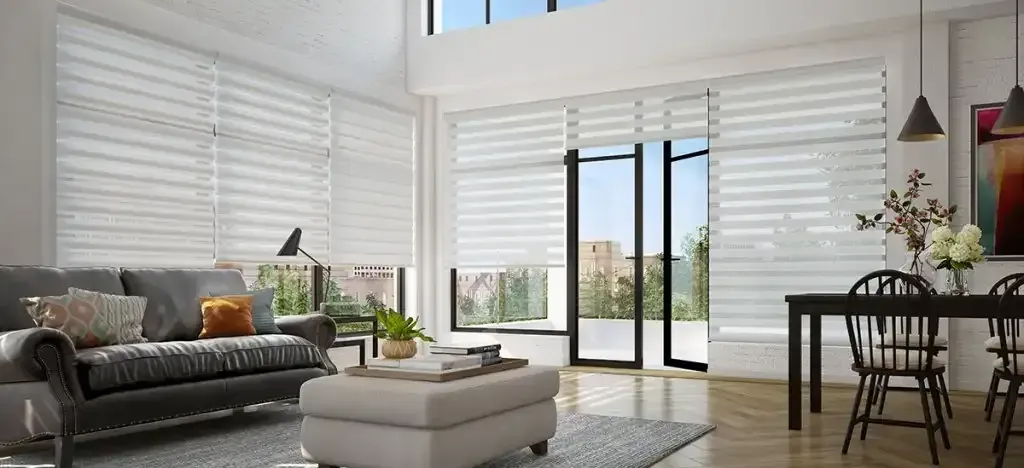 Bright modern living room with large windows and layered shades